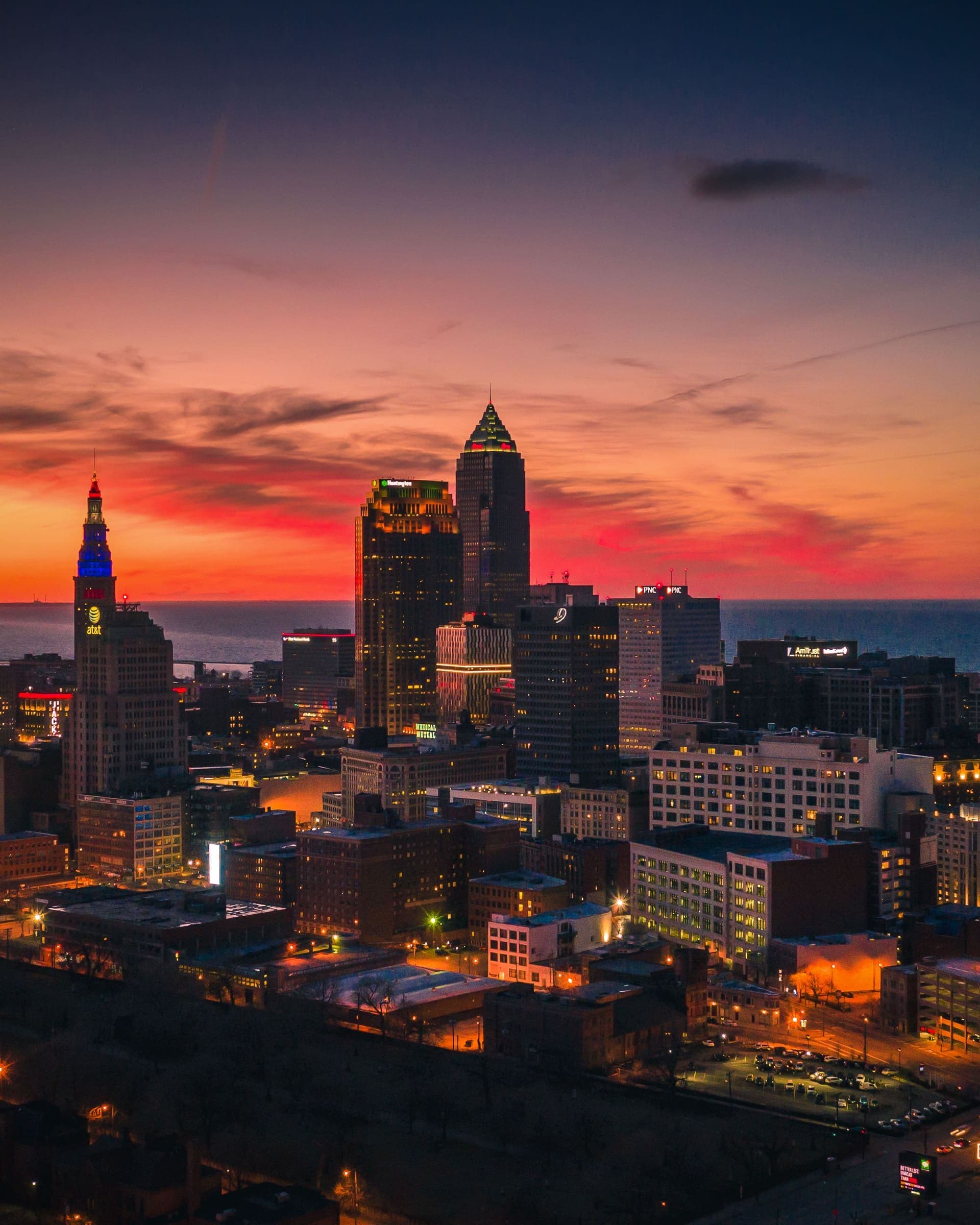 Downtown Cleveland at dusk under a red sky